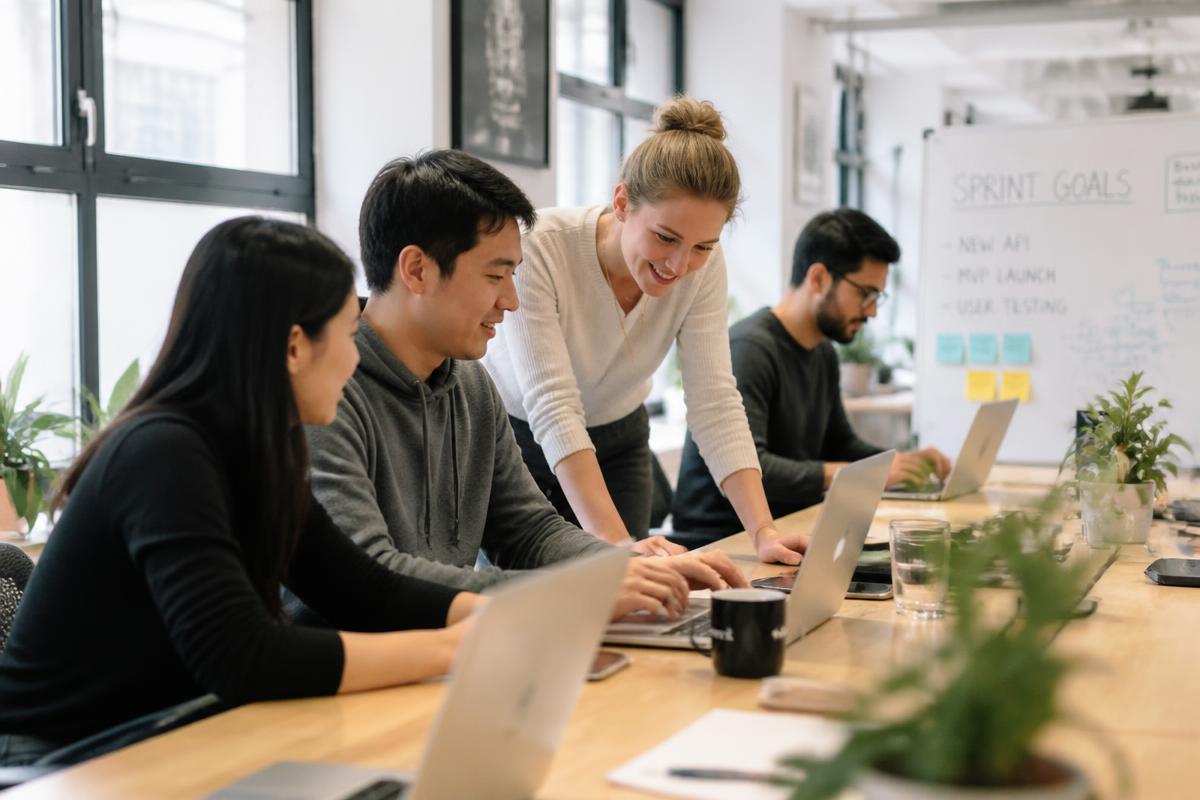 BXGI-placed engineers and designers collaborating in a bright modern office